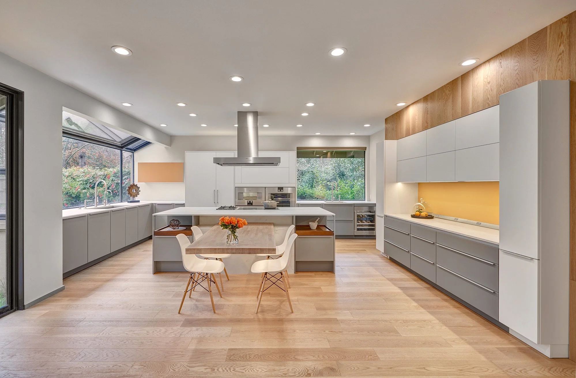 Modern whole home remodel, European cabinetry, kitchen, cantilevered island table, yellow glass splash, The Galley workstations