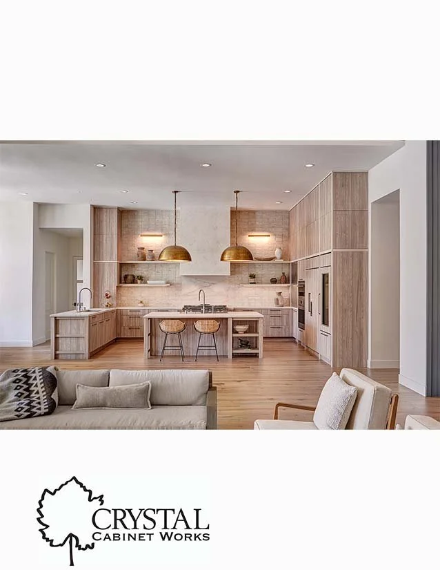 Modern open-concept kitchen with wood cabinets, a kitchen island with bar stools, pendant lighting, and a neutral color palette.