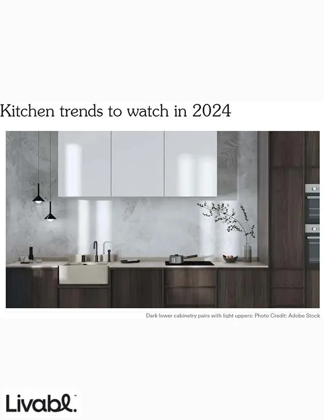 Modern kitchen with dark lower cabinets, light upper cabinets, and a minimalist design.