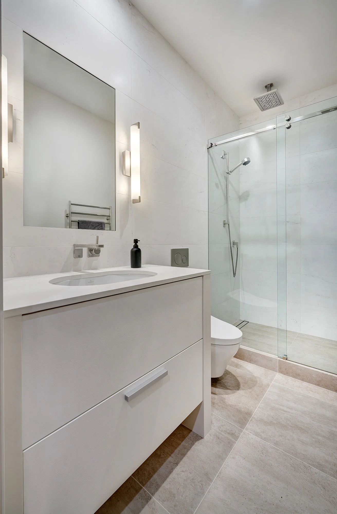 Modern whole home remodel, European cabinetry vanity, hall bath, frameless glass shower