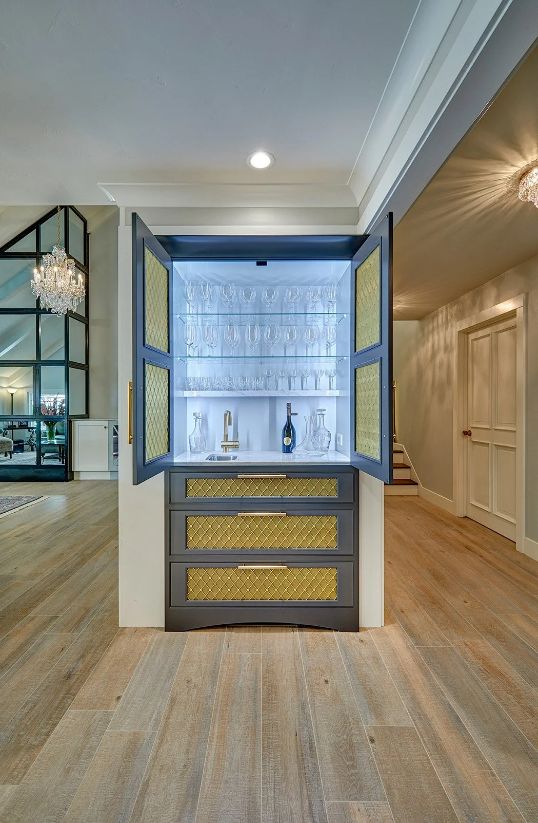 Whole home remodel, built in cabinetry bar, lit interior, metal mesh insert doors