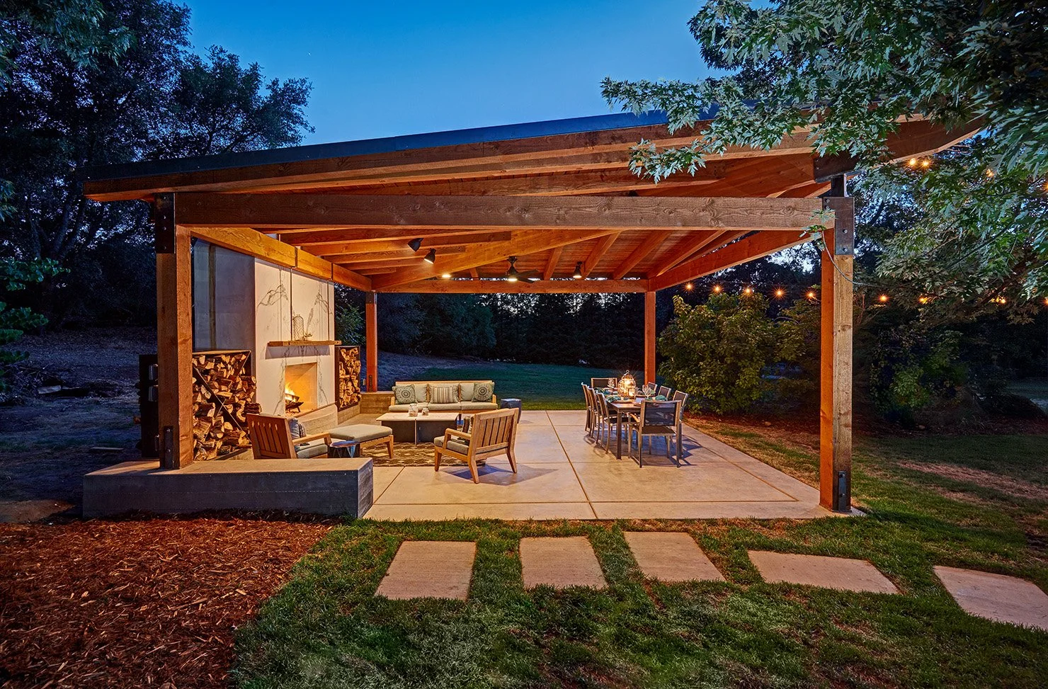 Whole home remodel, modern industrial outdoor lounge with Dekton clad fireplace