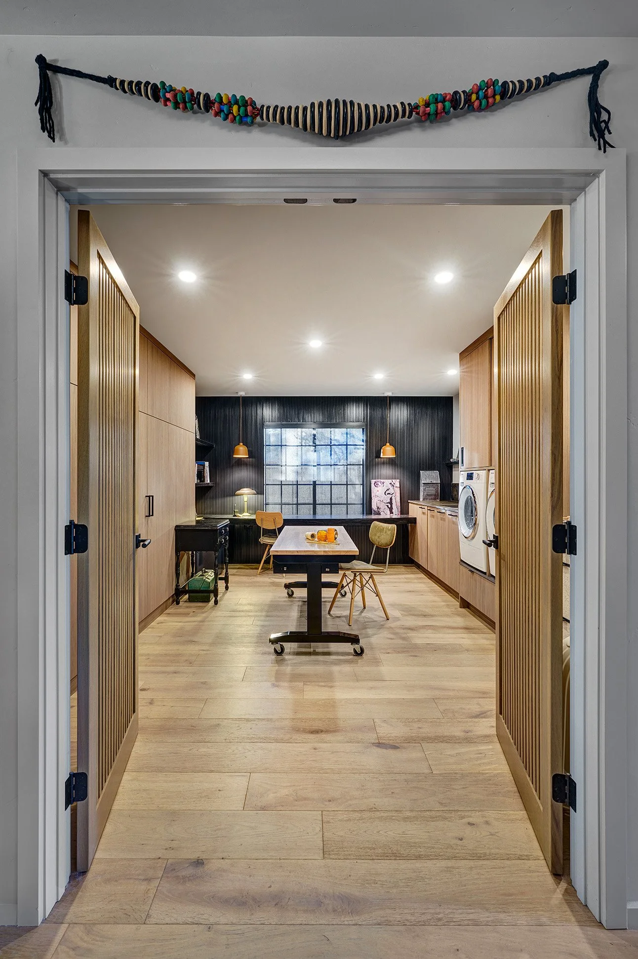 Craft, laundry, office, slatted wood doors, tall European cabinetry