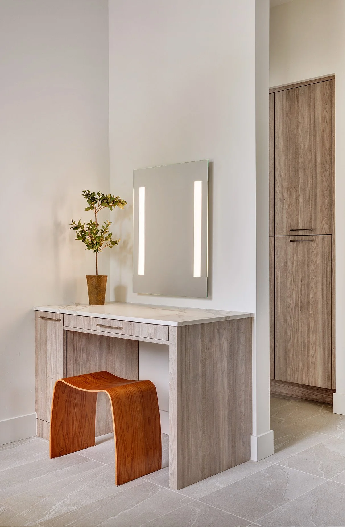 Warm modern new construction home, primary bathroom makeup station