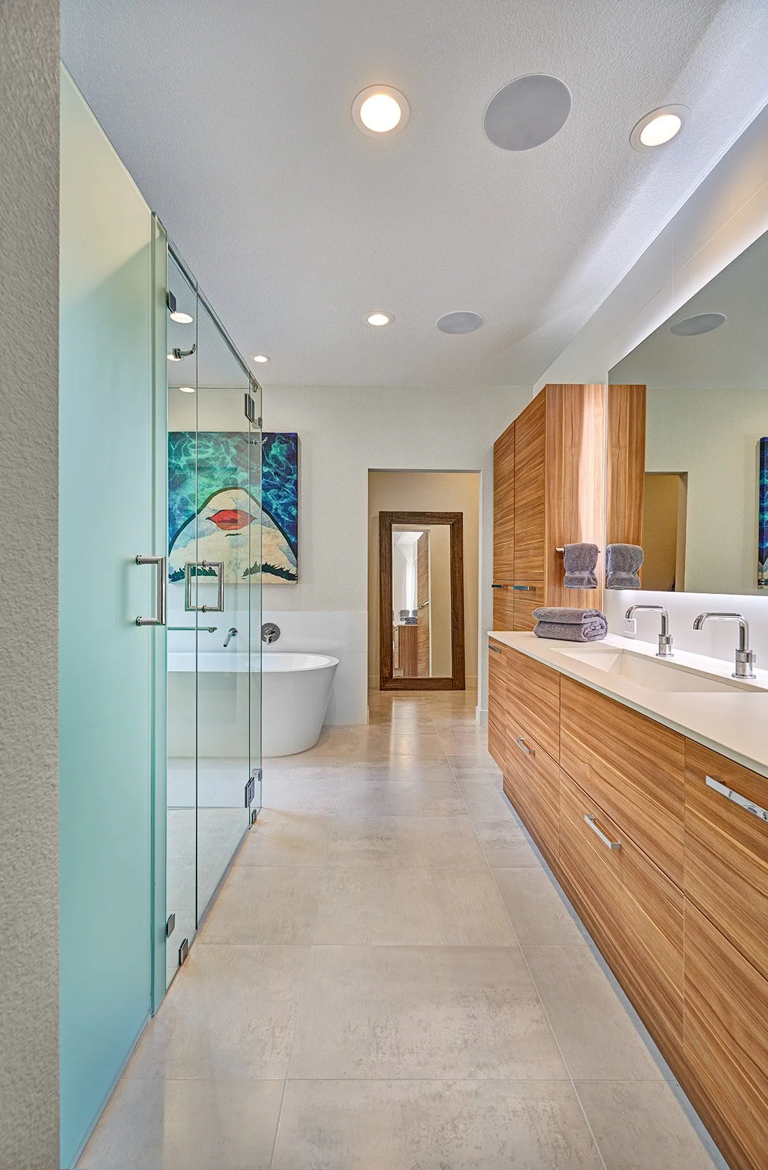 Modern primary bath remodel, European cabinetry, glass shower and toilet enclosures, freestanding tub