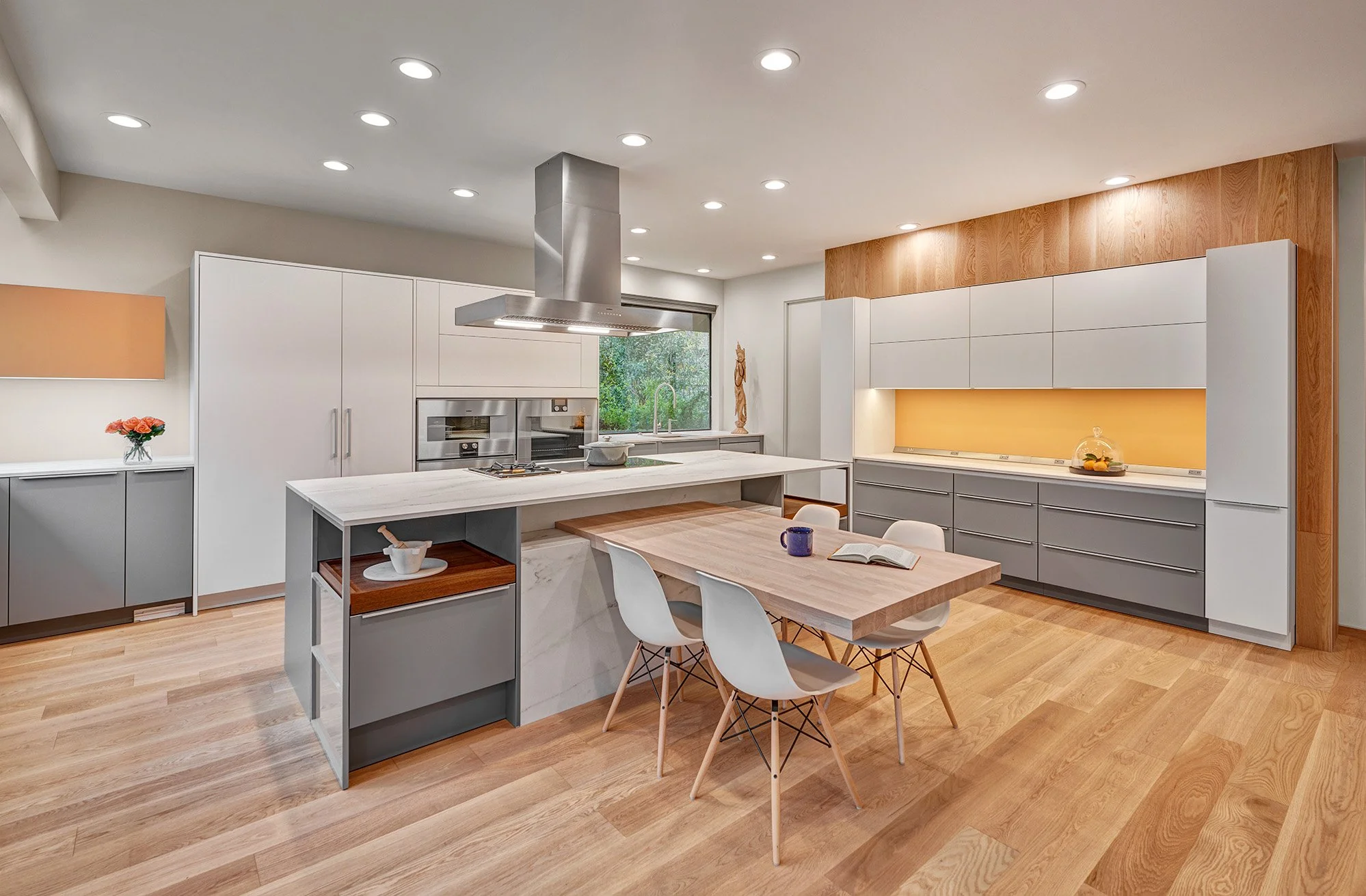 Modern whole home remodel, European cabinetry, kitchen, cantilevered island table, yellow glass splash, The Galley workstations